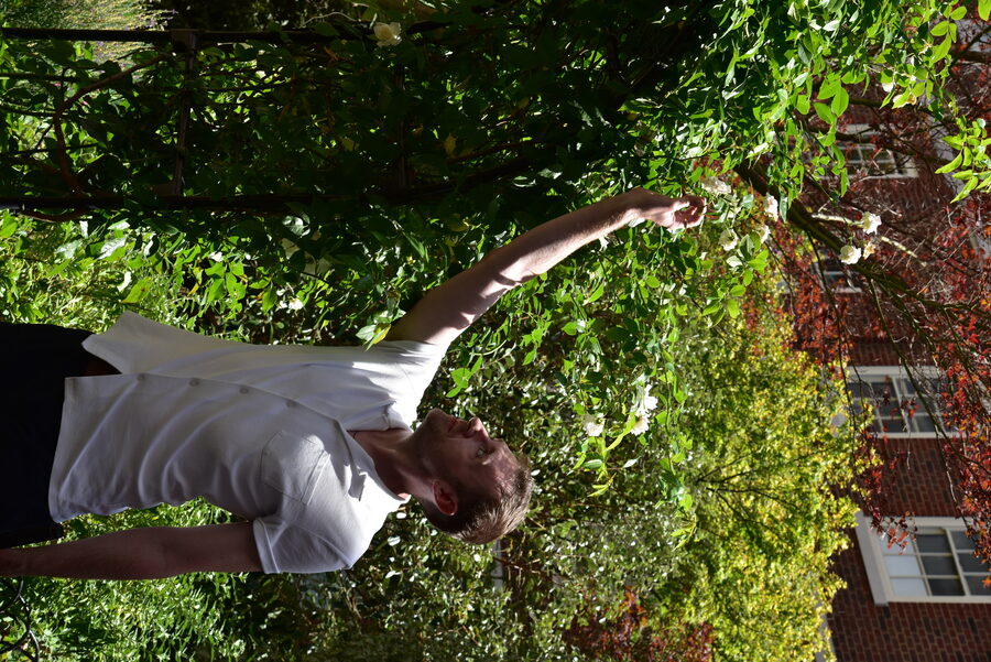 Cast member with roses in the garden